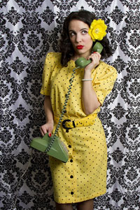 Woman wearing a black spotted yellow dress