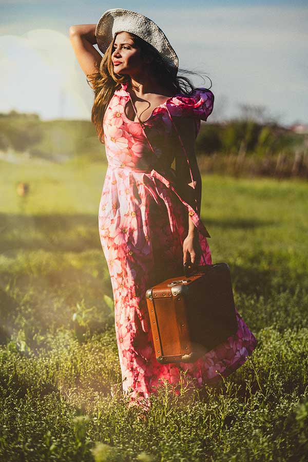 Woman wearing a vintage pink floral dress