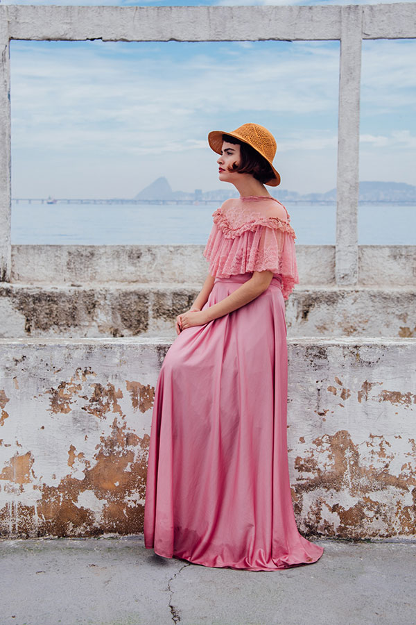 Woman wearing a vintage pink dress